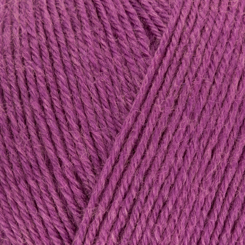 Close-up of purple yarn with a diagonal strand