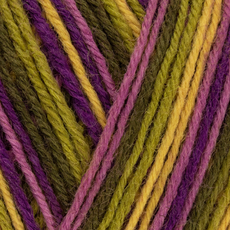 Close-up of multicolored yarn strands in green, purple, and yellow.