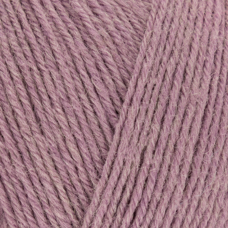Close-up of pink yarn with a focus on texture