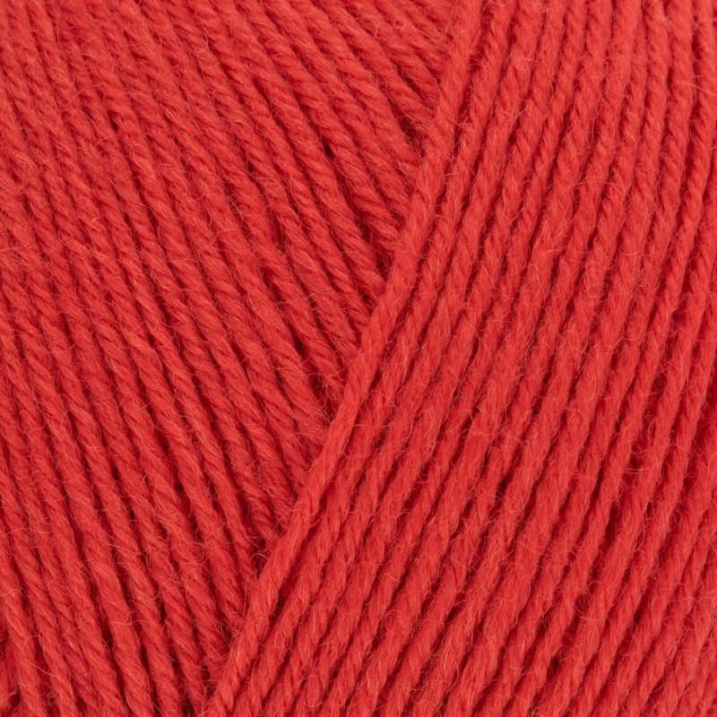 Close-up of red yarn with a diagonal pattern
