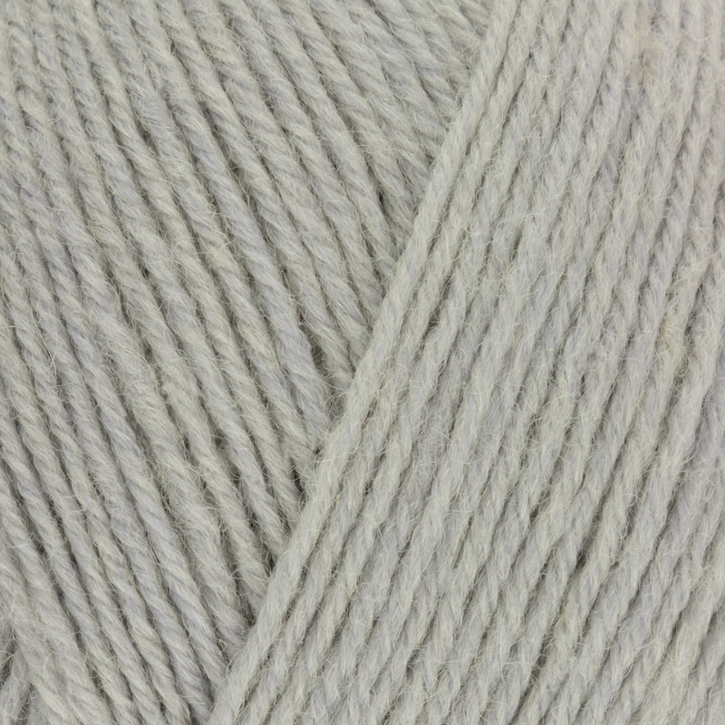 Close-up of light gray yarn with a slight texture