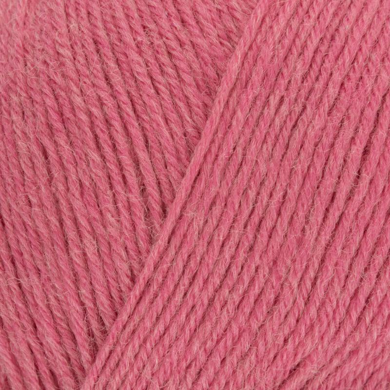 Close-up of pink yarn with a diagonal thread
