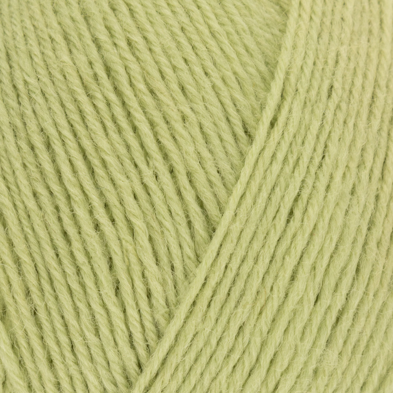 Close-up of light green yarn with a diagonal stripe