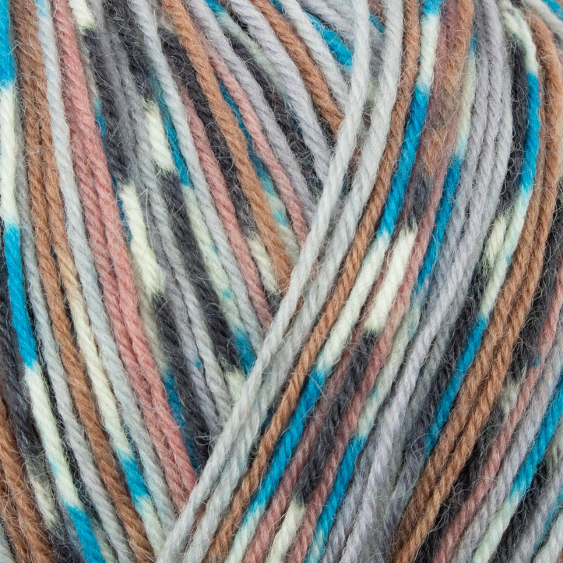 Close-up of multicolored yarn with brown, blue, and beige tones.