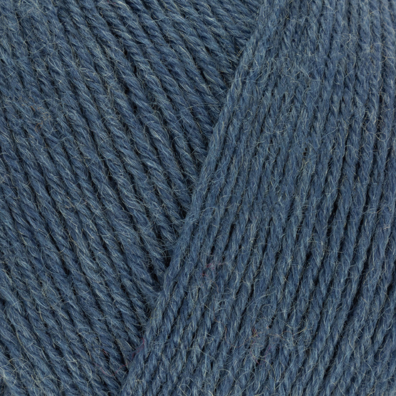 Close-up of blue yarn with a visible label