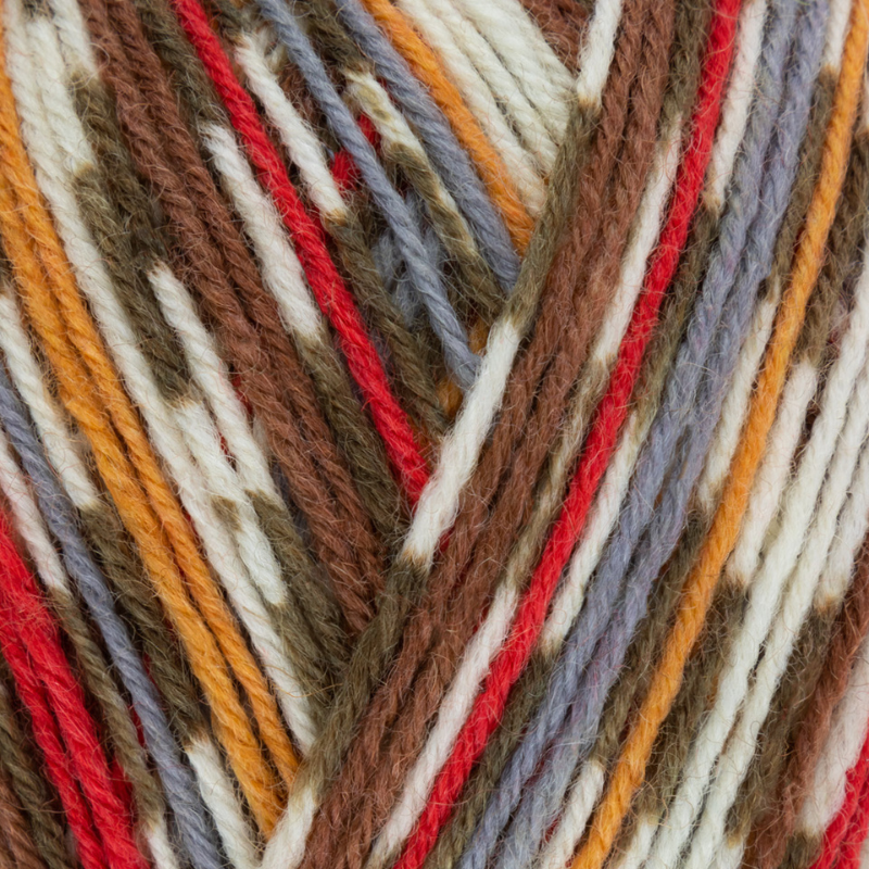 Close-up of multicolored yarn with red, orange, brown, and beige tones.