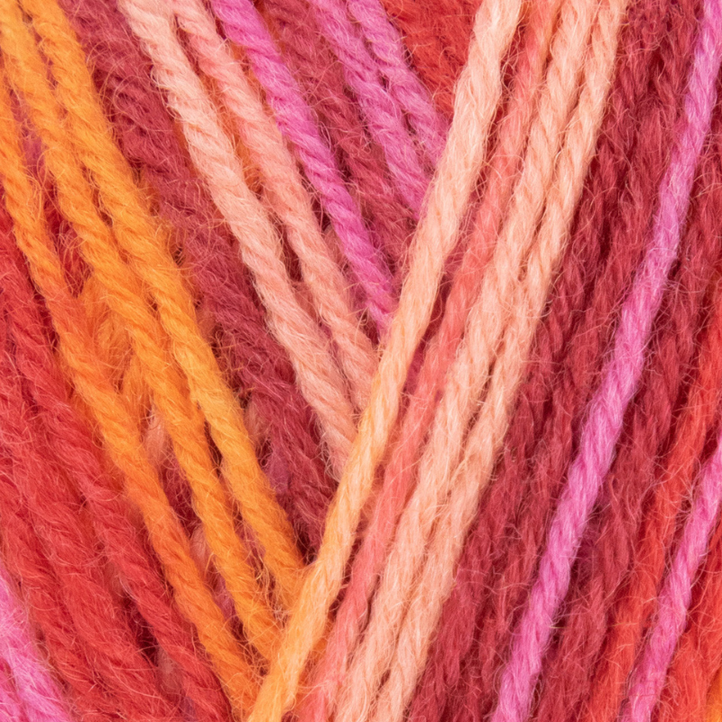 Close-up of multicolored yarn strands in shades of pink, orange, and red.