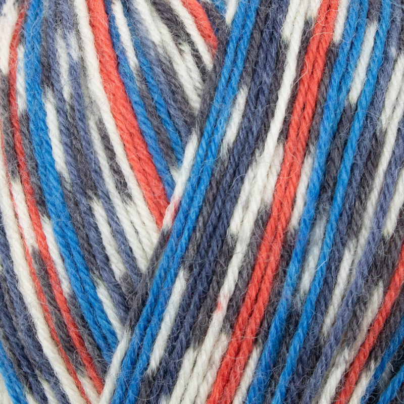 Close-up of multicolored yarn with red, blue, and white stripes.