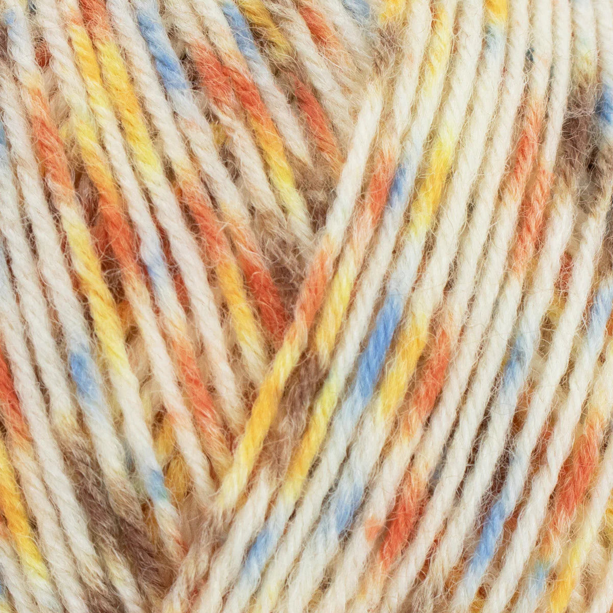 Close-up of multicolored yarn with orange, yellow, blue, and brown tones.