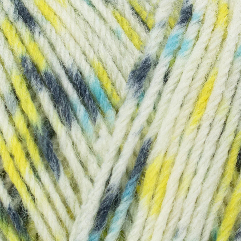 Close-up of multicolored yarn with yellow, blue, and gray patterns.